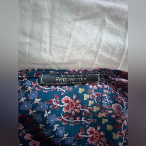 Peppermint dress, banded waist, pockets size small, cut out in back.